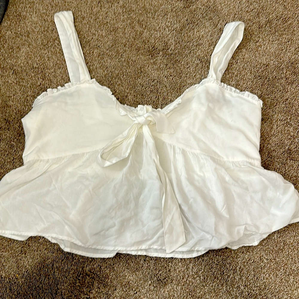 White blouse from American Eagle. Cropped and stretchy in the back. Size XL.